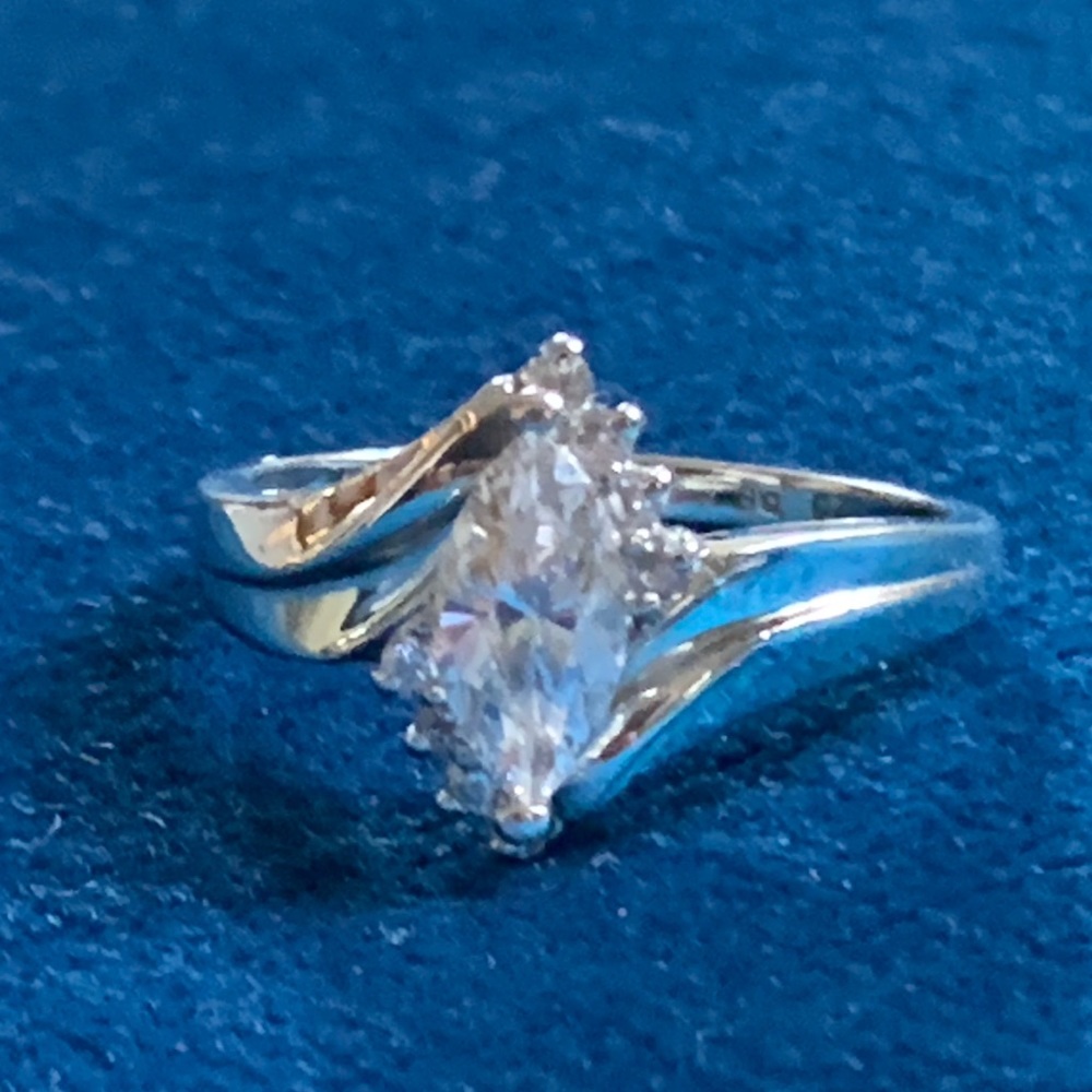 14K white gold ring, size 9, weighs over 5 grams.